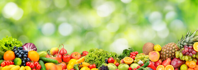 Beautiful berries, vegetables, fruits isolated on green