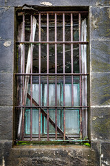 Old Broken Window with Bars