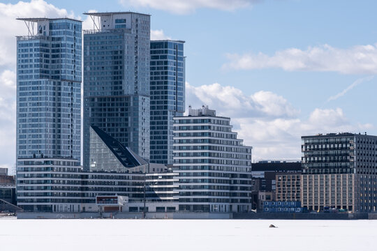 Modern highrise residential area on the waterfront during the wintertime.