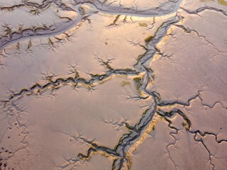 Aerial drone. Salt marshes at low tide exposing mud flats and streams at Motney Hill, Medway, Kent, England.