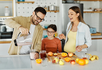 woman pregnant food healthy juice fruit kitchen family child fresh diet mother preparing blender...