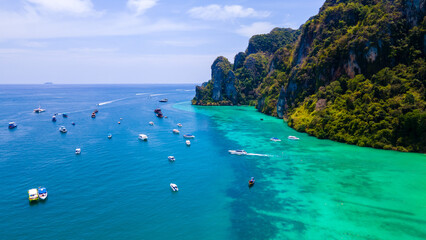Fototapeta premium High angle, beautiful sea, and tourists boats at Phi Phi Island, Phuket, Thailand