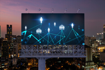 Glowing Social media icons on billboard over night panoramic city view of Bangkok. The concept of networking and establishing new connections between people and businesses in Southeast Asia