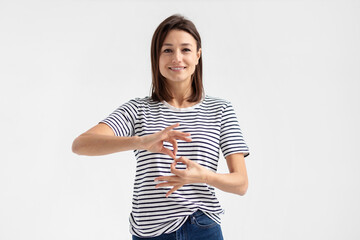 Deaf mute young caucasian woman on white background - obrazy, fototapety, plakaty