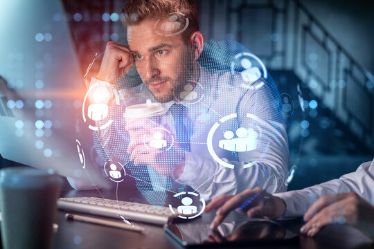 Two colleagues in formal wear working together looking for new employees to hire for international business consulting. HR, social media icons over modern office background