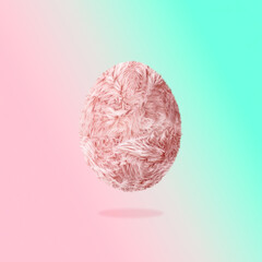 Creative Easter concept of light pink long fiber soft fur egg. Pastel background. Fuzzy shaggy blanket. Fluffy fake textile.  Fashion style winner egg on pastel background.