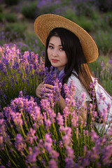 woman in a straw hat in a lavender field