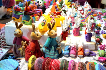 Stuffed colorful rabbits for sale on street