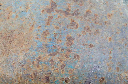 Red Rust Stains On A Metal Background Wall