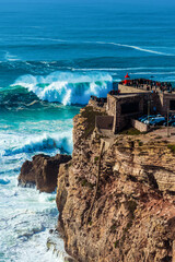 Big waves in Nazare, Portugal. Waves of the Atlantic Ocean in Portugal. Waves for surfing.