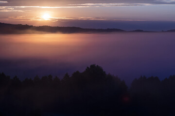 Fototapeta na wymiar Foggy morning over the steppe and the river. Dawn in the fog.