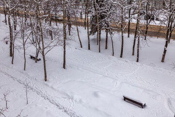 Pushkino, Russia, April 3, 2022. View of the boulevard covered by an unexpected snowfall. weather anomaly.