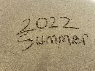 2022 summer is coming , summer writing on the beach