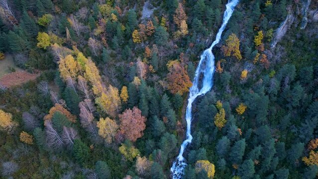Waterfall in the surroundings of the Barranco de Urdiceto and the Bielsa Valley on the Barrosa River. Mixed forest in autumn in the Pyrenees Mountains. Huesca Province, Aragon, Spain, Europe