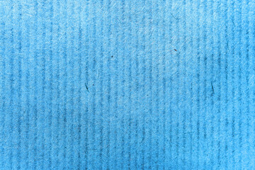 A sheet of blue paper close-up, paper fibers macro, background with vertical stripes copy