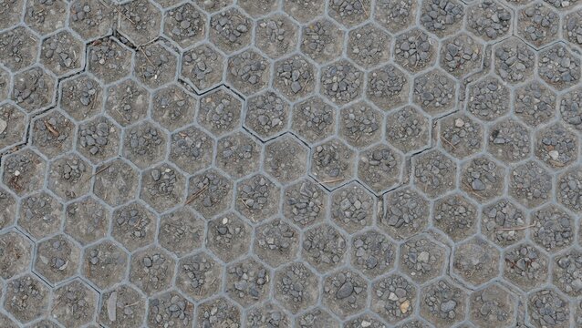 Plastic and gravel hardstanding over grass with hexagonal design - image