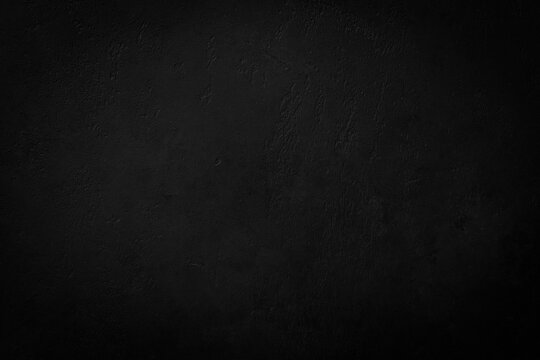 Abstract black background with scratches. Grungy textured blackboard