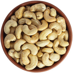 Cashew in a brown ceramic bowl. Isolated close-up photo of food close up from above on white background.