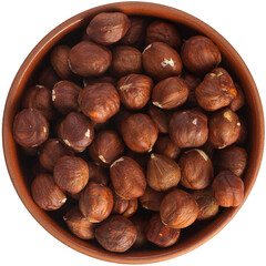 Hazelnuts in a brown ceramic bowl. Isolated close-up photo of food close up from above on white background.