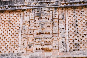 Mayan stone carving on the wall of the Nunnery Quadrangle, Uxmal archaeological site, Yucatan, Mexico, UNESCO World Heritage Site