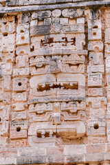 Mayan stone carving on the wall of the Nunnery Quadrangle, Uxmal archaeological site, Yucatan, Mexico, UNESCO World Heritage Site