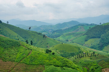 View of forests and mountains and clouds in the sky at northern Thailand.
