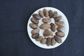 The Brazil nut (Bertholletia excelsa) is a South American tree in the family Lecythidaceae, and it is also the name of the tree's commercially harvested edible seeds. Amazonas, Brazil.