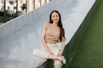 Attractive woman sitting outdoors