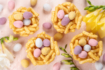 Springtime sweet nests filled with chocolate Easter eggs. Spring season. Happy easter card.