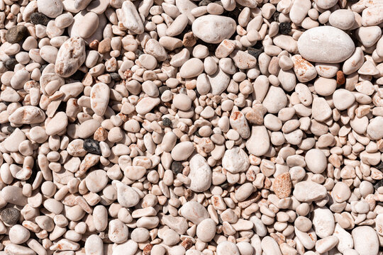 background of pebble stones on the beach