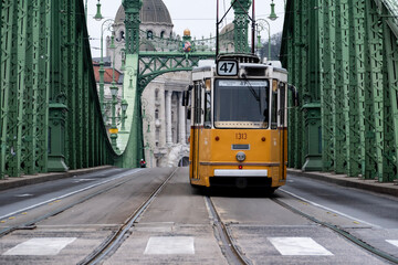Fototapeta na wymiar Historical tram no.47 crossing Budapest freedom bridge
