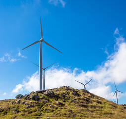 Landscape with wind turbine for power generation.