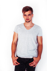 young handsome teenage hipster guy posing emotional, happy smiling against white background isolated, lifestyle people concept