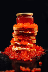 mountain of caviar on a black background