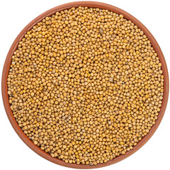 Mustard Seeds in a brown ceramic bowl isolated on white background. Isolated close-up photo of food close up from above on white background.