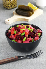 Vinaigrette traditional russian salad with boiled vegetables, pickled cucmbers, fresh onion, venegar and oil