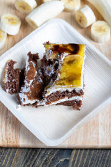 a piece of banana cake and fresh sliced bananas