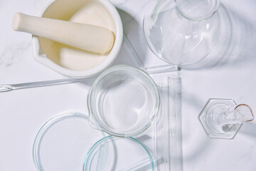 Fototapeta na wymiar Group of scientific laboratory glassware with clear liquid solution, Science research and development concept, Bio science skincare.