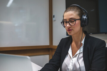 Relaxed businesswoman meditating in office