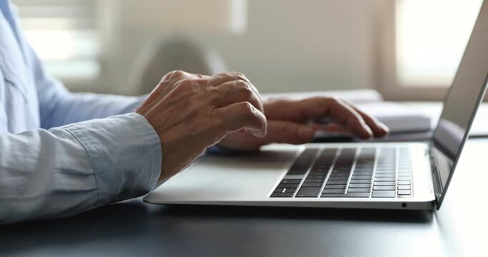 Close up older woman hands texting e-mail on modern laptop keyboard, writing message use wireless computer, lead correspondence to client remotely, search information on internet. Technology concept