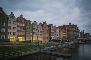 Fototapeta na wymiar Gdansk old town and famous crane in cloudy day. Gdansk, Poland. November 2021