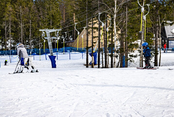 skiers on ski resort, lift in the mountain, ski resort in the mountains, Tryvann, Oslo, Norway