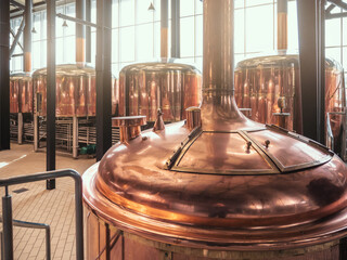 Brewery equipment. Brew manufacturing. Round cooper storage tanks for beer fermentation and...