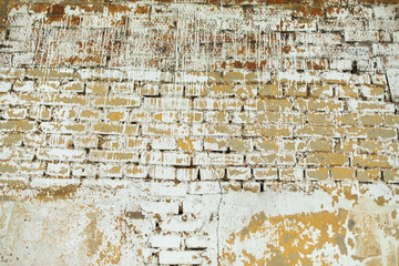 Old brick wall. Bad paint on wall.