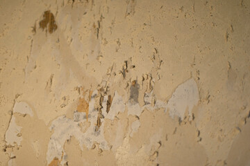 Texture of stripped wallpaper from wall. Paper is torn. Repair details.