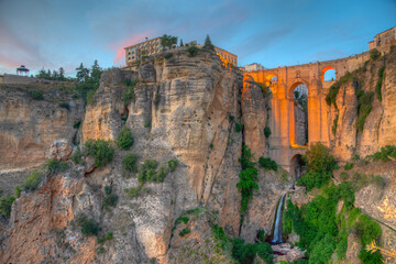 Sunset view of Puente nuevo bridge in Spanish town Ronda. © dudlajzov