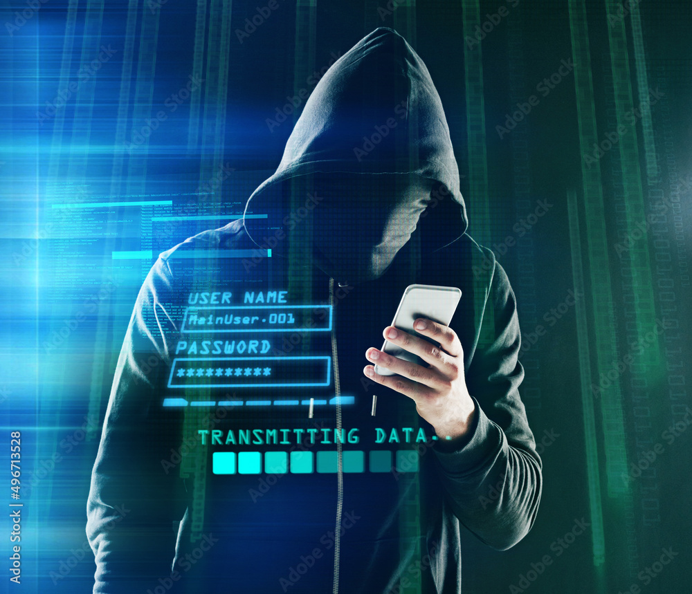 Poster hacking just got a little easier. shot of an unidentifiable computer hacker using a smartphone while
