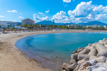 Sunny day at Puerto Banus beach at Marbella, Spain. - obrazy, fototapety, plakaty