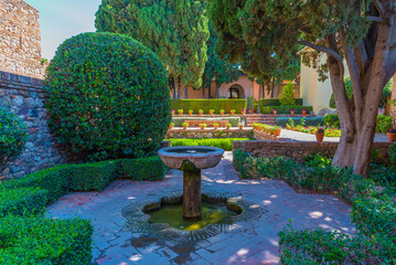 view of a garden of the alcazaba fortress in the spanish city malaga.