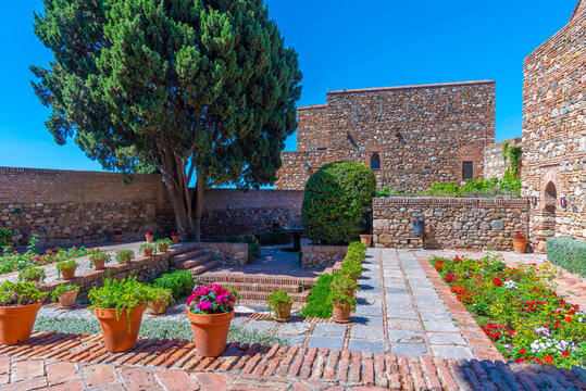 view of a garden of the alcazaba fortress in the spanish city malaga.